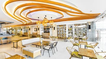 A modern cafe with a central seating area, wooden ceiling design, and a view of the city.