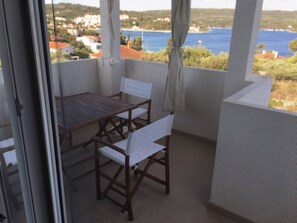Enjoy a balcony with a scenic view of the water and distant landscape.