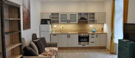 Télévision, cheminée, baby-foot