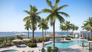 Outdoor pool, a heated pool, free cabanas, pool umbrellas