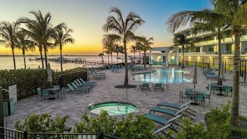 Outdoor pool, a heated pool, free cabanas, pool umbrellas