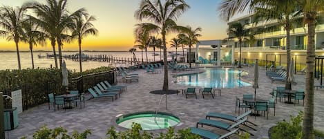 Outdoor pool, a heated pool, free cabanas, pool umbrellas