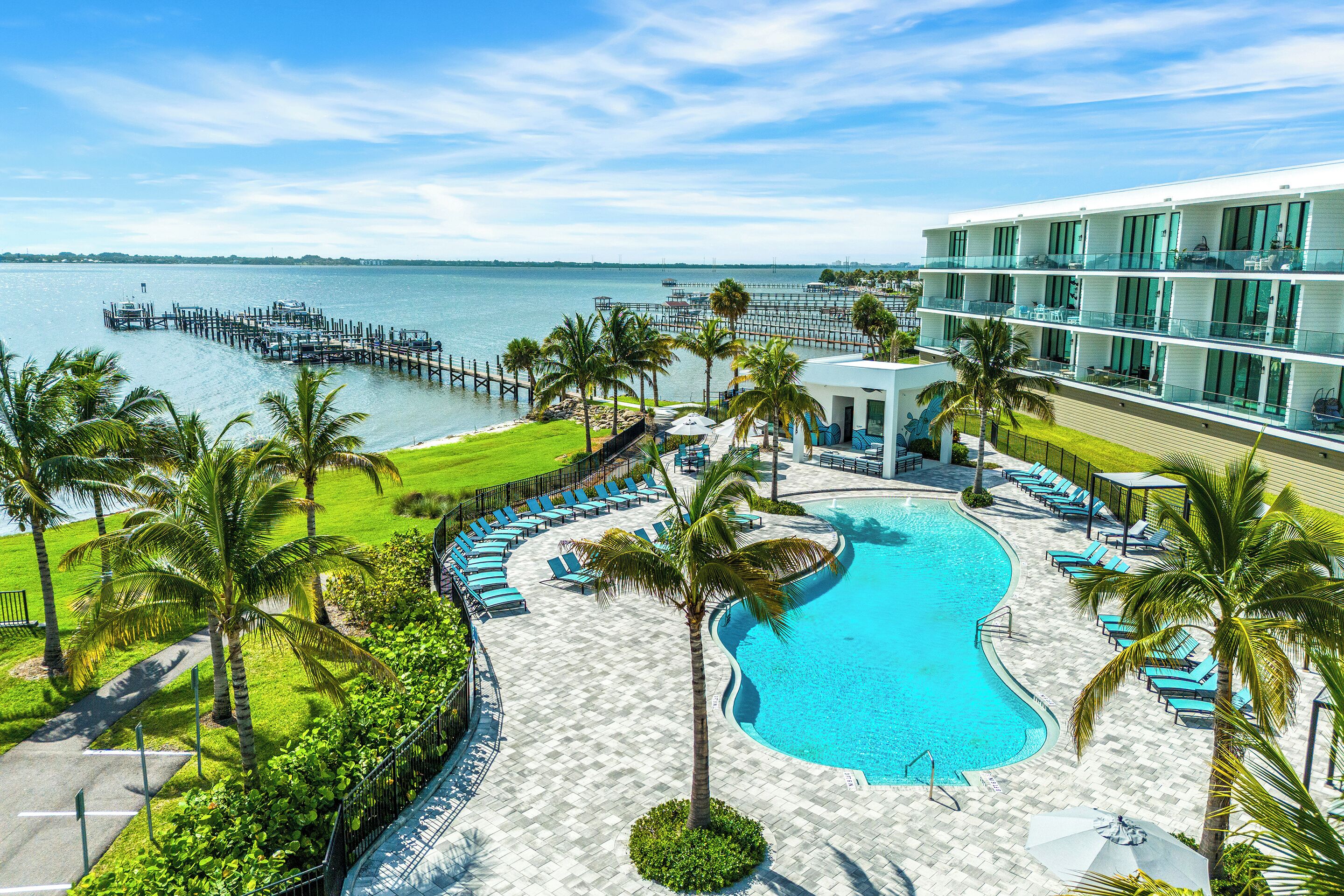Outdoor pool, a heated pool, free cabanas, pool umbrellas
