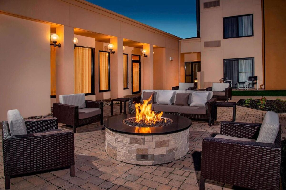 Gather under the stars around a cozy firepit lounge.