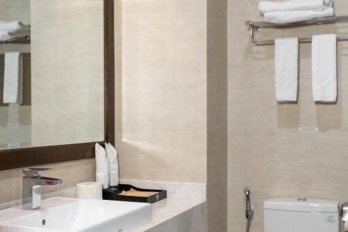 Bathroom | Designer toiletries, hair dryer, bathrobes, slippers