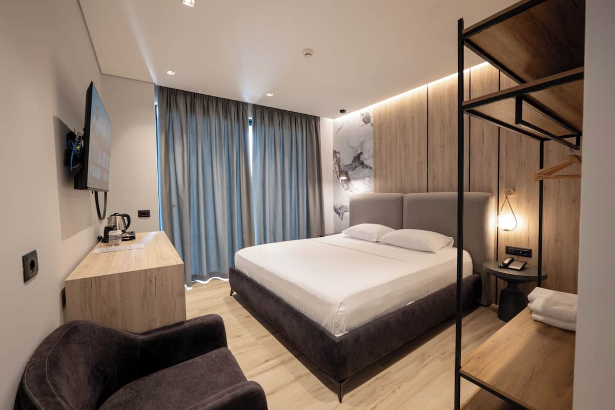 Deluxe Double Room, Sea View | Hypo-allergenic bedding available, desk, laptop workspace, soundproofing