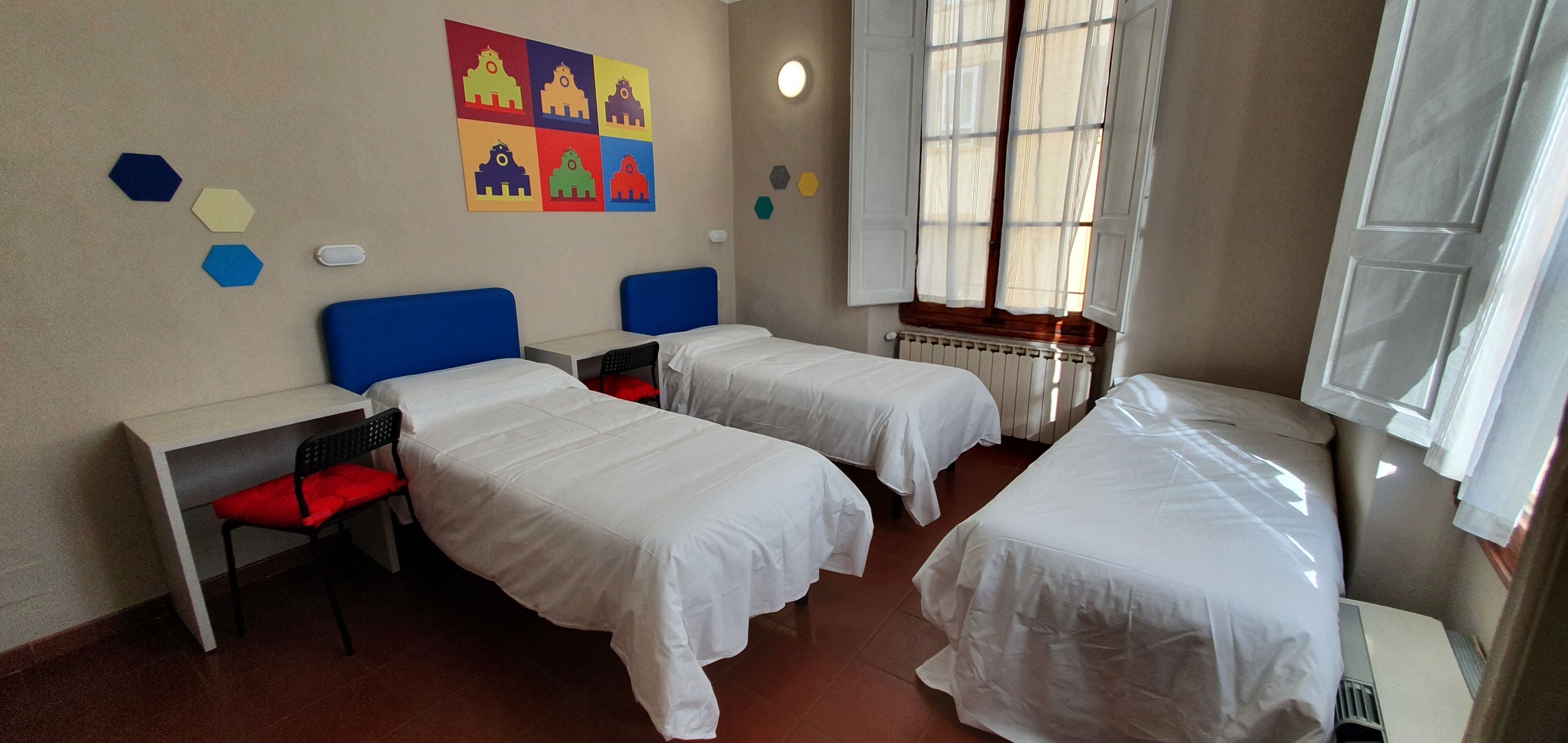 Triple Room | Down comforters, desk, laptop workspace, blackout drapes