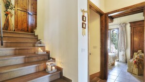 A staircase with wooden steps and white lanterns.