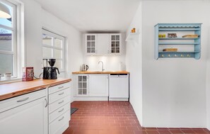 Fridge, stovetop, dishwasher, coffee/tea maker
