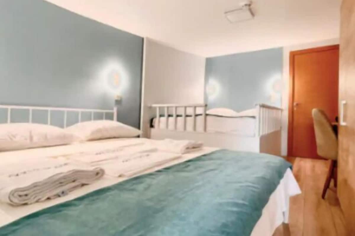 Family Room | In-room safe, desk, laptop workspace, blackout drapes