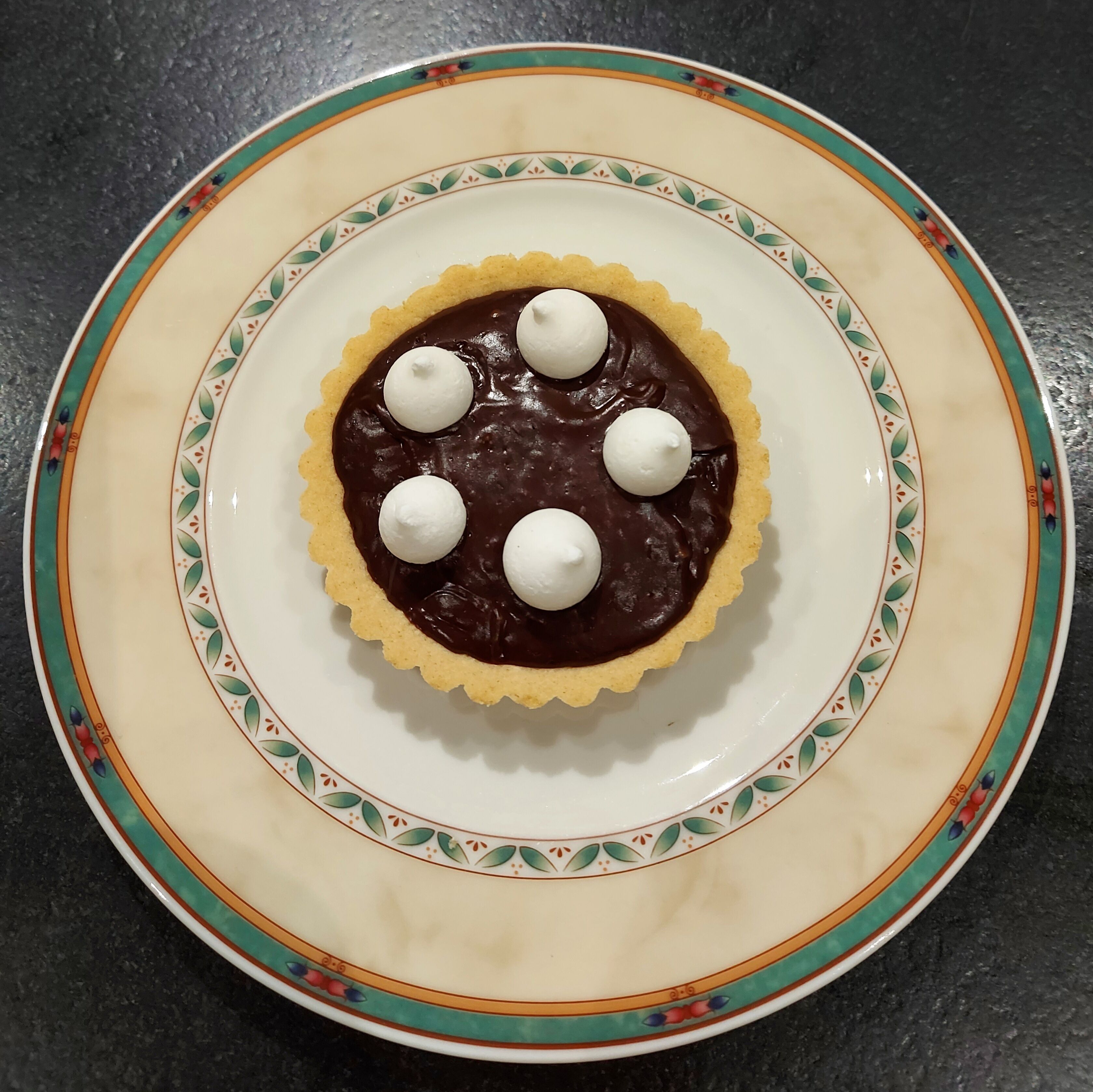 A dessert on a decorative plate.