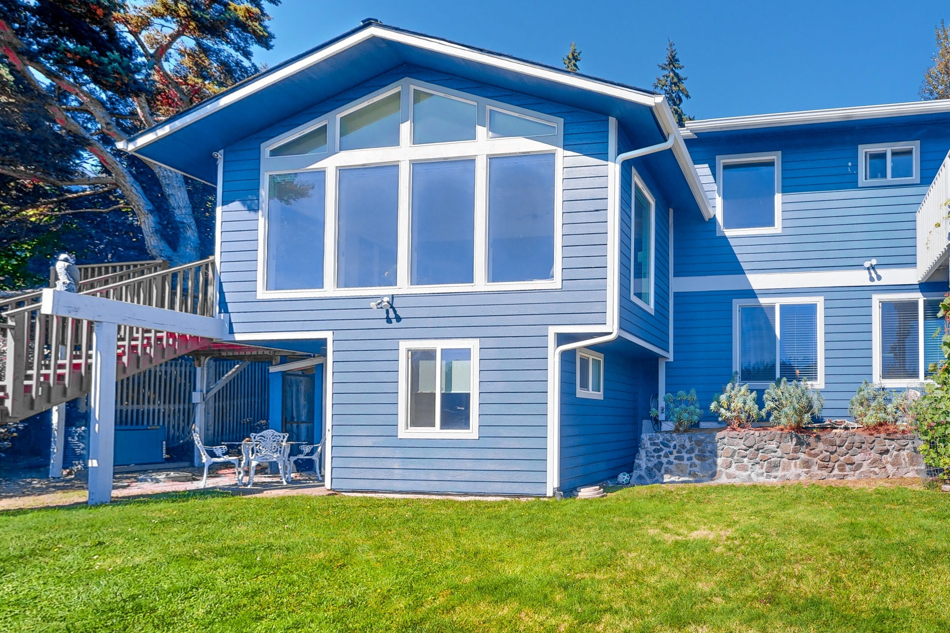 Waterfront home with private beach, amazing views, great deck, & game room