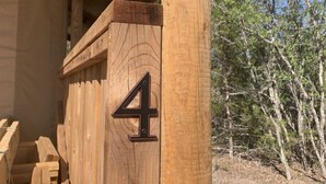 A wooden structure with a number '4' indicating a room or section.