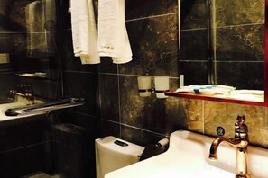 A bathroom with a white sink, a mirror, and a towel rack. - Nanyi Hotel (Chishui)