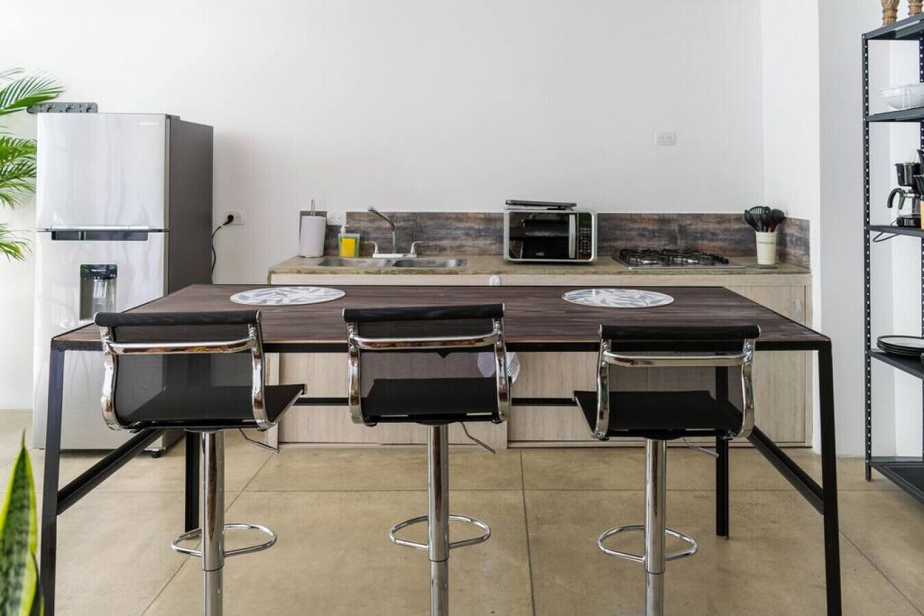 Fridge, microwave, coffee/tea maker, cookware/dishes/utensils