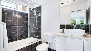 Bathtub, hair dryer, towels