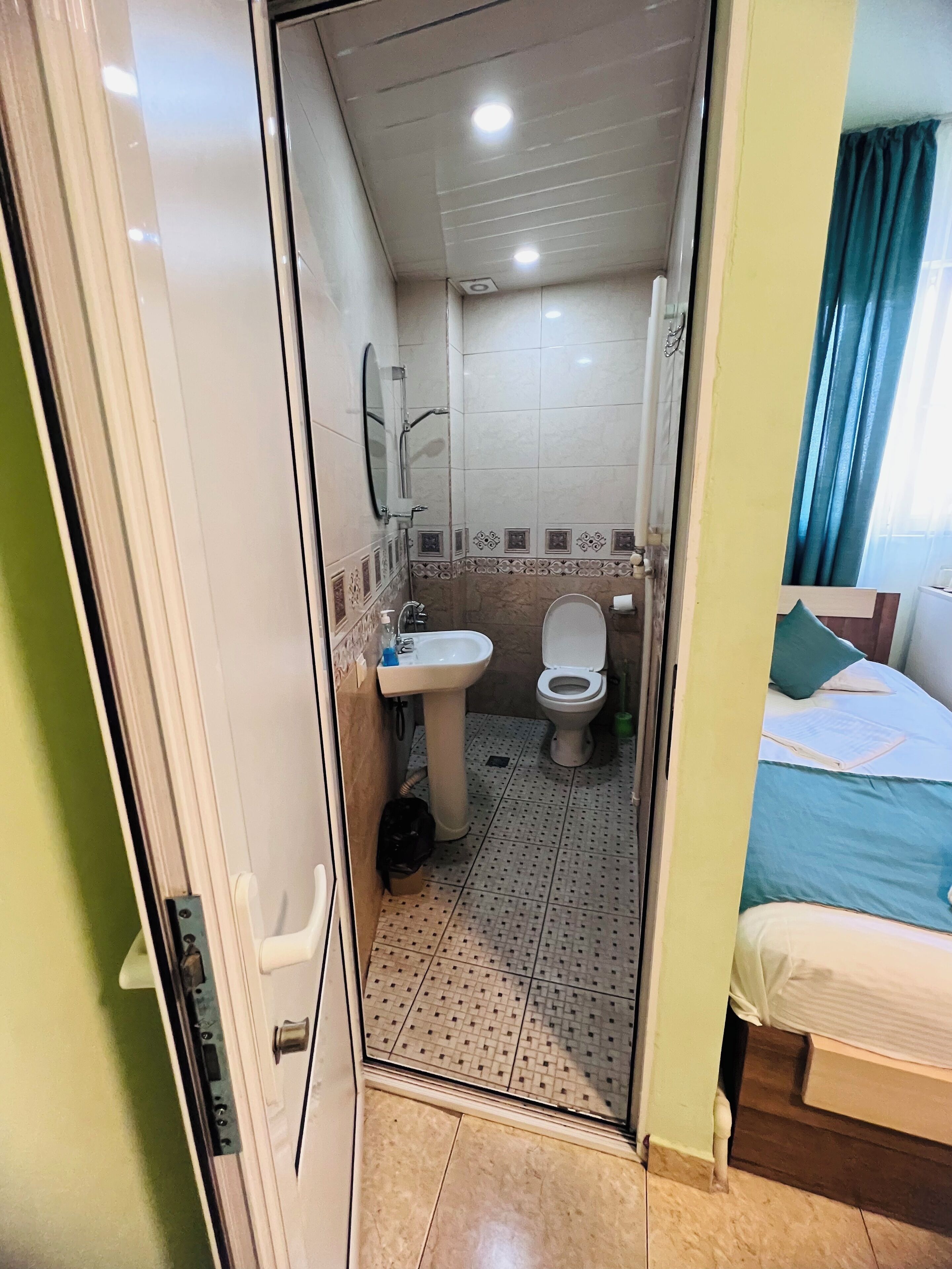 standard quadruple room | bathroom | shower, hair dryer, slippers, towels