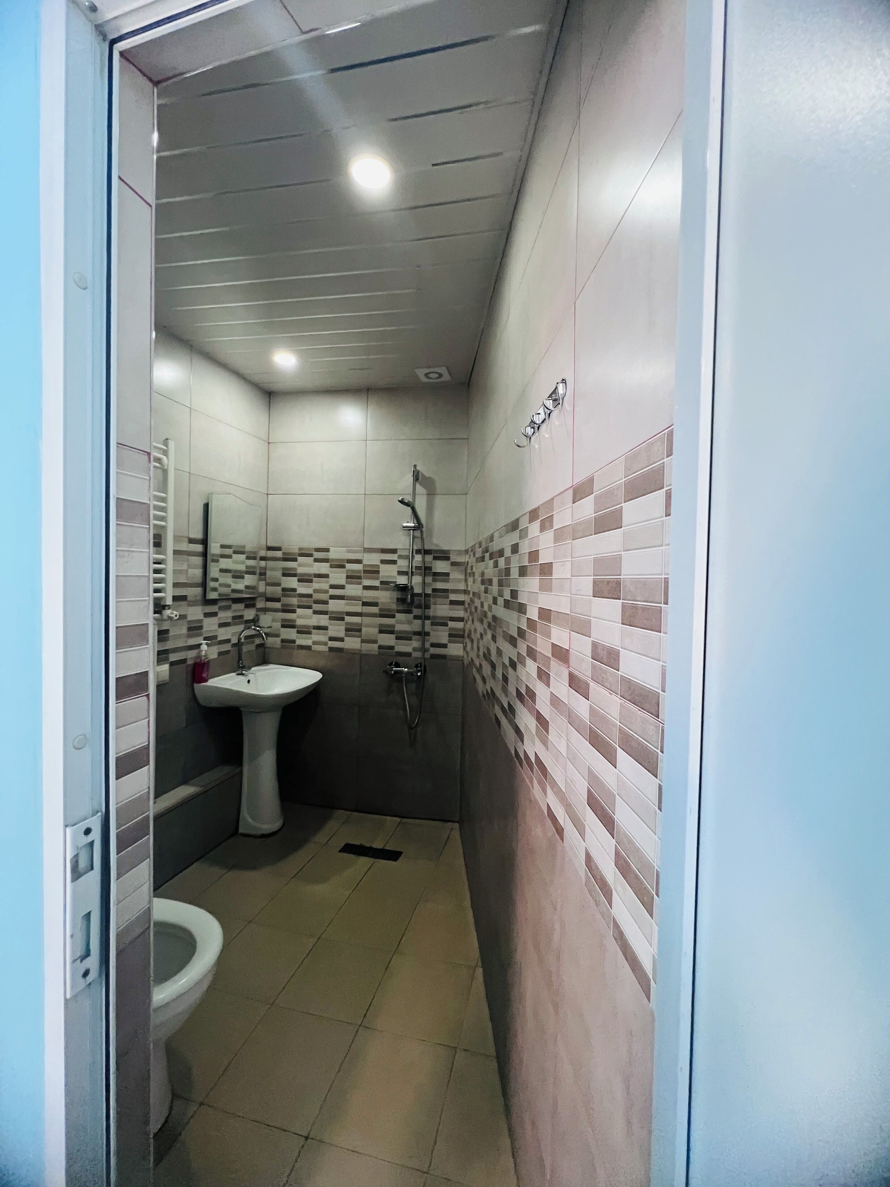 family room | bathroom | shower, hair dryer, slippers, towels