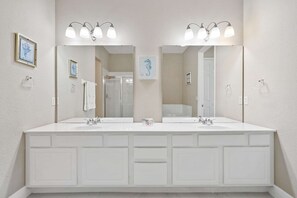 Private bathroom suite with a bathtub and a walk- in shower - Premium 3BR condo Resort Perks near Epic Universe! (Orlando)