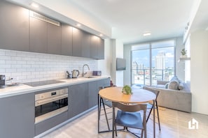 Comfort Apartment, 1 Bedroom, Balcony, City View | Private kitchen | Oven, toaster, cookware/dishes/utensils, paper towels - Downtown Miami Condos by Lua Host (Miami)