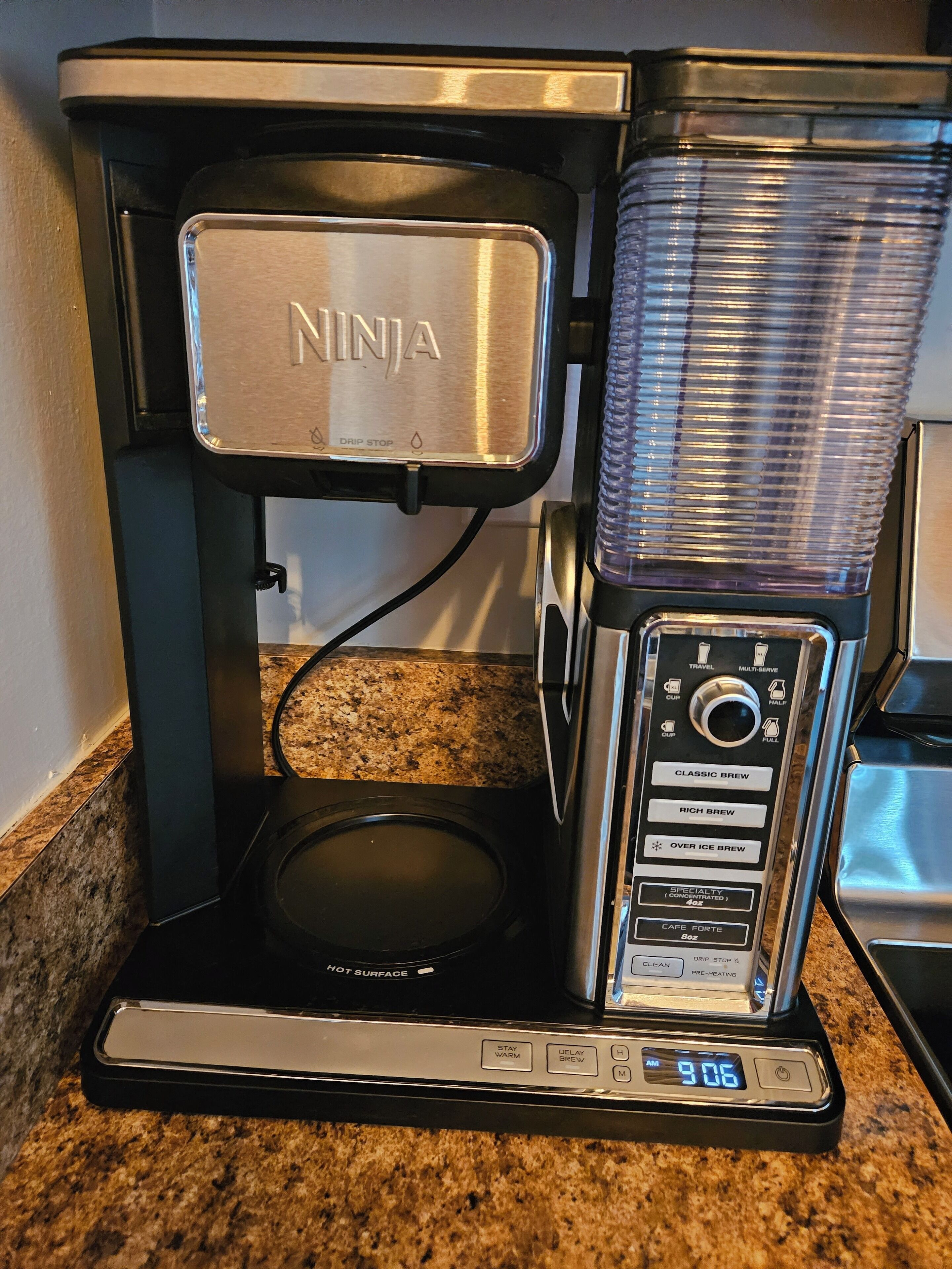 A Ninja coffee maker with a digital display, drip stop, and various brew settings.