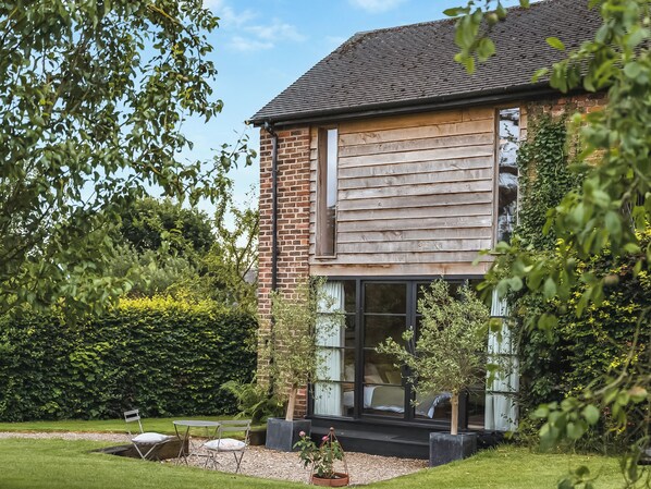 A two-story house with a brick exterior and large windows. - 1 bedroom accommodation in Willington, near Tarporley (Willington, near Tarporley)