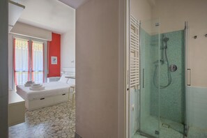 Shower, hair dryer, towels, toilet paper