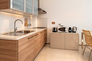 Fridge, microwave, stovetop, coffee/tea maker