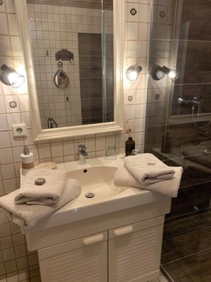 Shower, hair dryer, towels, soap