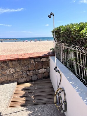 On the beach, sun-loungers