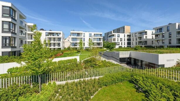 A modern residential complex with multiple apartment buildings, green spaces, and a clear sky. - Naviflat- Luxury Sopot Residence Okrzei 21 by Lion Apartments (Sopot)