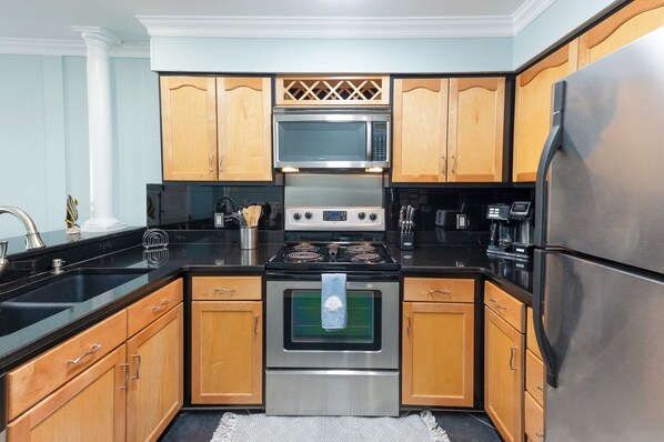 Coffee/tea maker, dining tables - Hobbs Realty - Oceanfront Condo w/Private Oceanfront Balcony (Holden Beach)