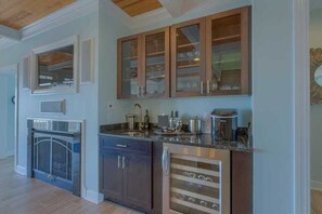 Fridge, dishwasher, paper towels, dining tables