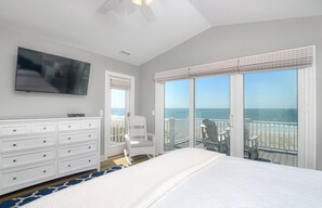 Relax in this serene space with a large bed, flat-screen TV, and ocean views from the balcony.