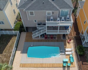 A heated pool - Hobbs Realty - "Sand Froonie House" offers luxury amenities, including a private swimming pool! (Holden Beach)
