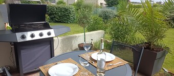 Bright, renovated garden apartment facing the sea.