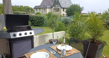 Bright, renovated garden apartment facing the sea.