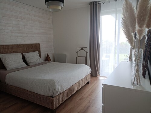 Bright, renovated garden apartment facing the sea.