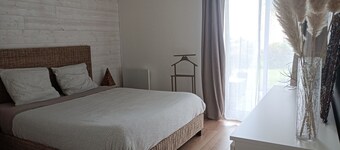 Bright, renovated garden apartment facing the sea.