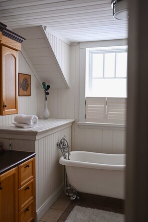 Shower, hair dryer, towels, toilet paper