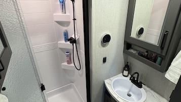 Hair dryer, towels, soap, shampoo