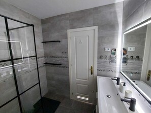 Shower, hair dryer, towels, soap