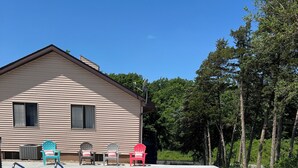 A swimming pool with a house in the background. - Beautiful house on Lake Rathbun with in-ground pool & 50-amp camper hookup (Plano)