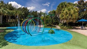 A water play area with multiple water jets and a circular pool. - Bahama Bay third floor unit close to Disney (Davenport)
