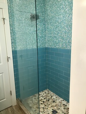 Shower, towels, soap, toilet paper