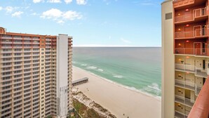 A high-rise hotel with multiple balconies overlooking a beach. - Shores of Panama Unit 2107~3 bedroom 3 bath~Sleeps 8 (Panama City Beach)
