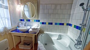 Combined shower/tub, hair dryer, towels, soap