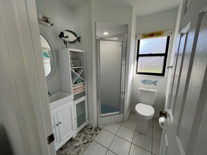 Shower, towels, soap, toilet paper