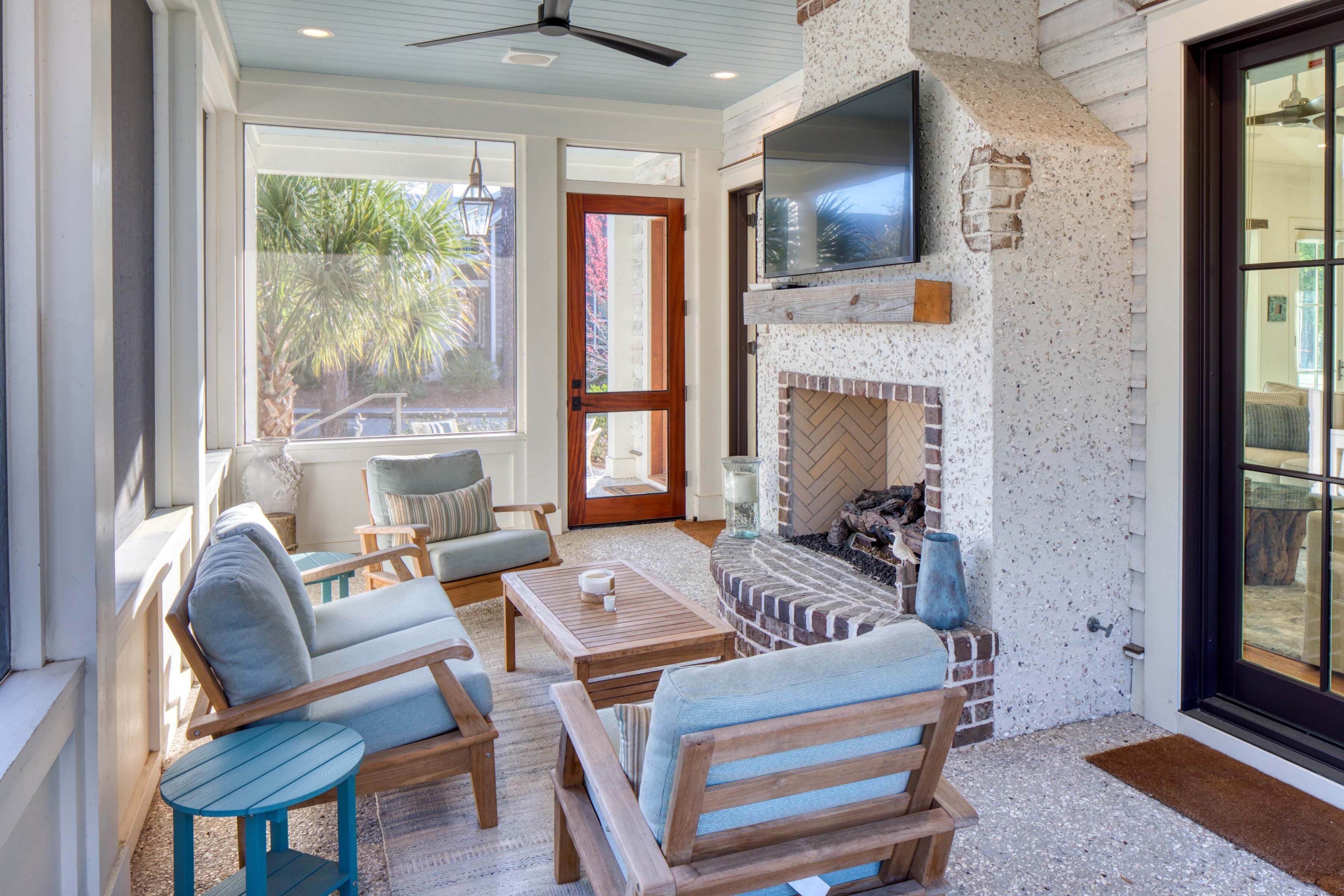 A cozy living area with a fireplace, comfortable seating, and a television.