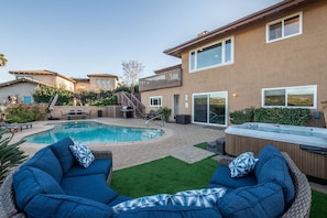 A backyard with a swimming pool, a hot tub, and outdoor seating. - Amazing Escape with Game Room, Pool & Hot Tub (Escondido)